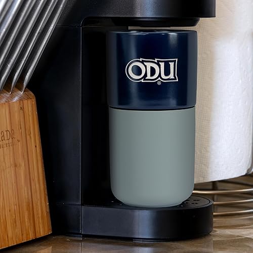 Miniatura 484 de Rico Industries NCAA Miami of Ohio Redhawks - Vaso de cerámica de 16 onzas con agarre de silicona, grabado láser profundo, diseño de color negro