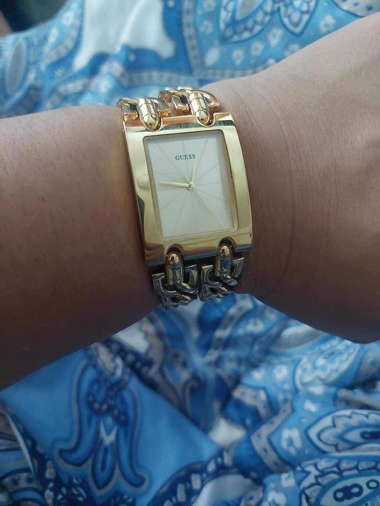 Pulseira dourada de aço inox Guess