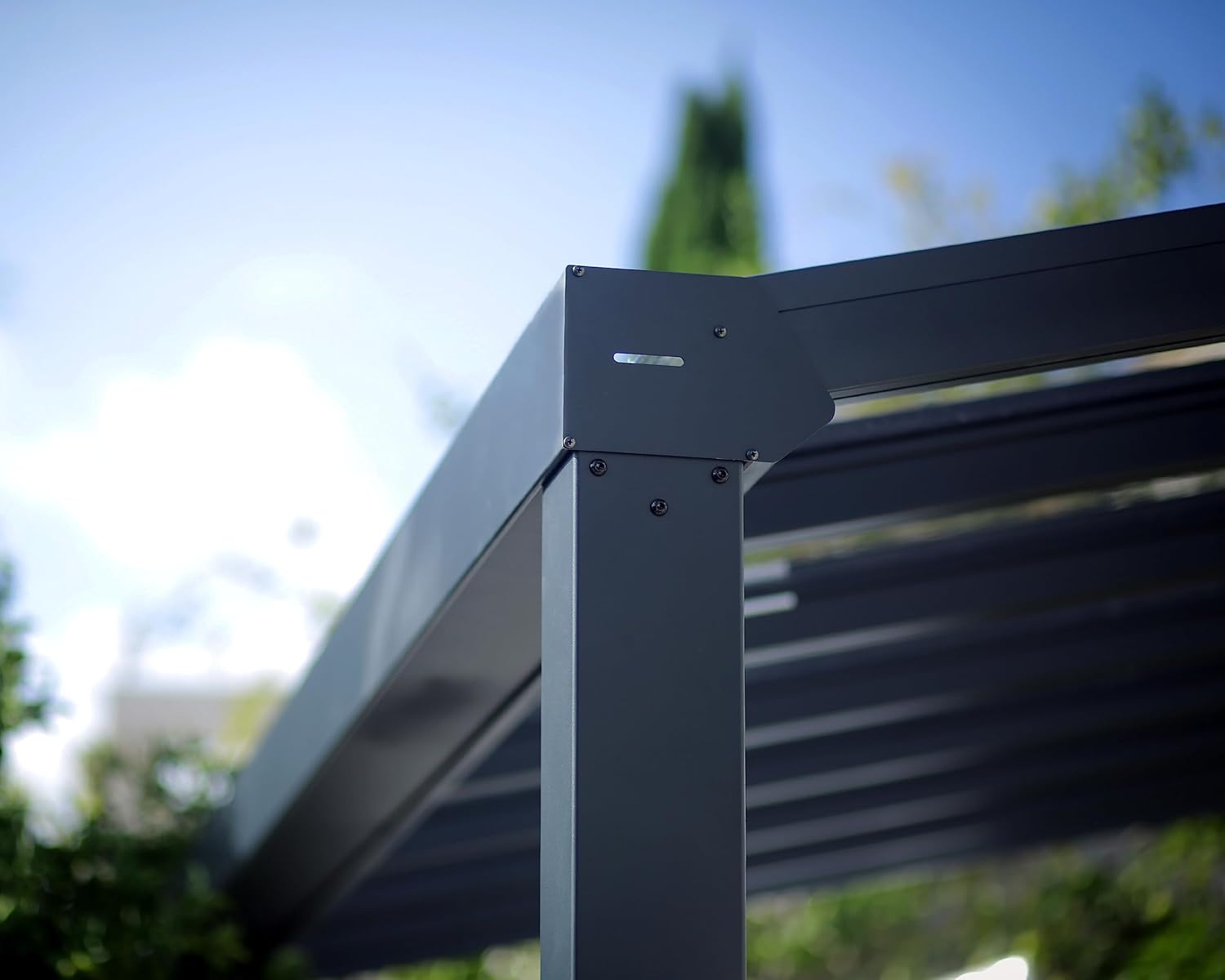 Close-up of the water drainage outlet on a support post