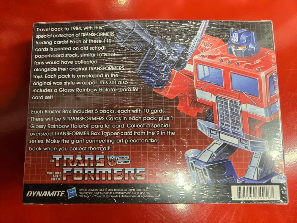 2024 Dynamite Trans Formers 40th Anniversary Factory Sealed Blaster Box 5 Packs + 1 Oversized 5 x 7 Card. 9 Transformers Trading Cards plus 1 Glossy Rainbow Holofoil Parallel Per Pack.