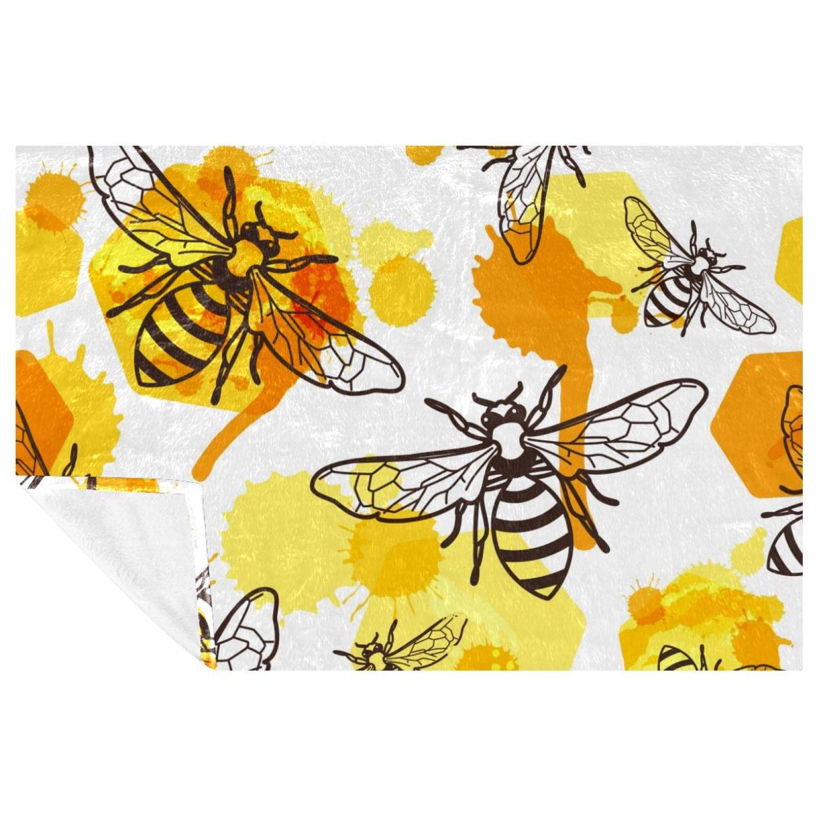 Plaid chaud abeille et miel contre le froid sur canapé