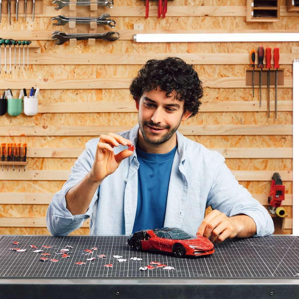 Person assembling the Ferrari SF90 Stradale 3D puzzle