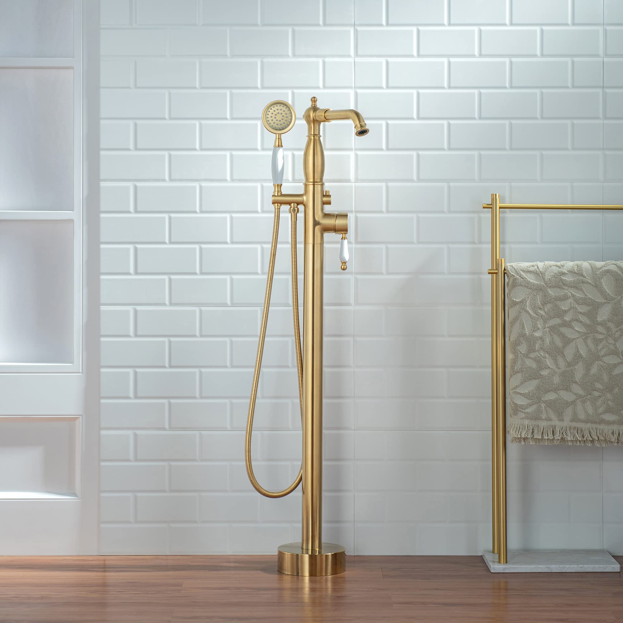 woodbridge contemporary single handle floor mount freestanding tub filler faucet with hand shower in brushed gold finish