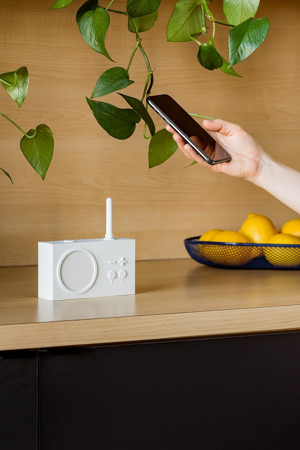 Lexon TYKHO 3 in a bathroom setting, demonstrating its splash-proof feature