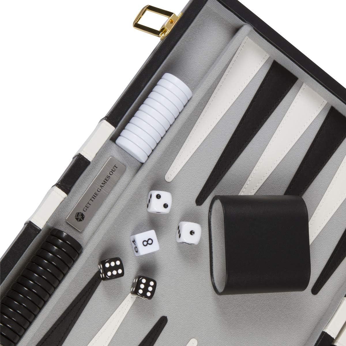 Close-up of backgammon dice, shakers, and checkers