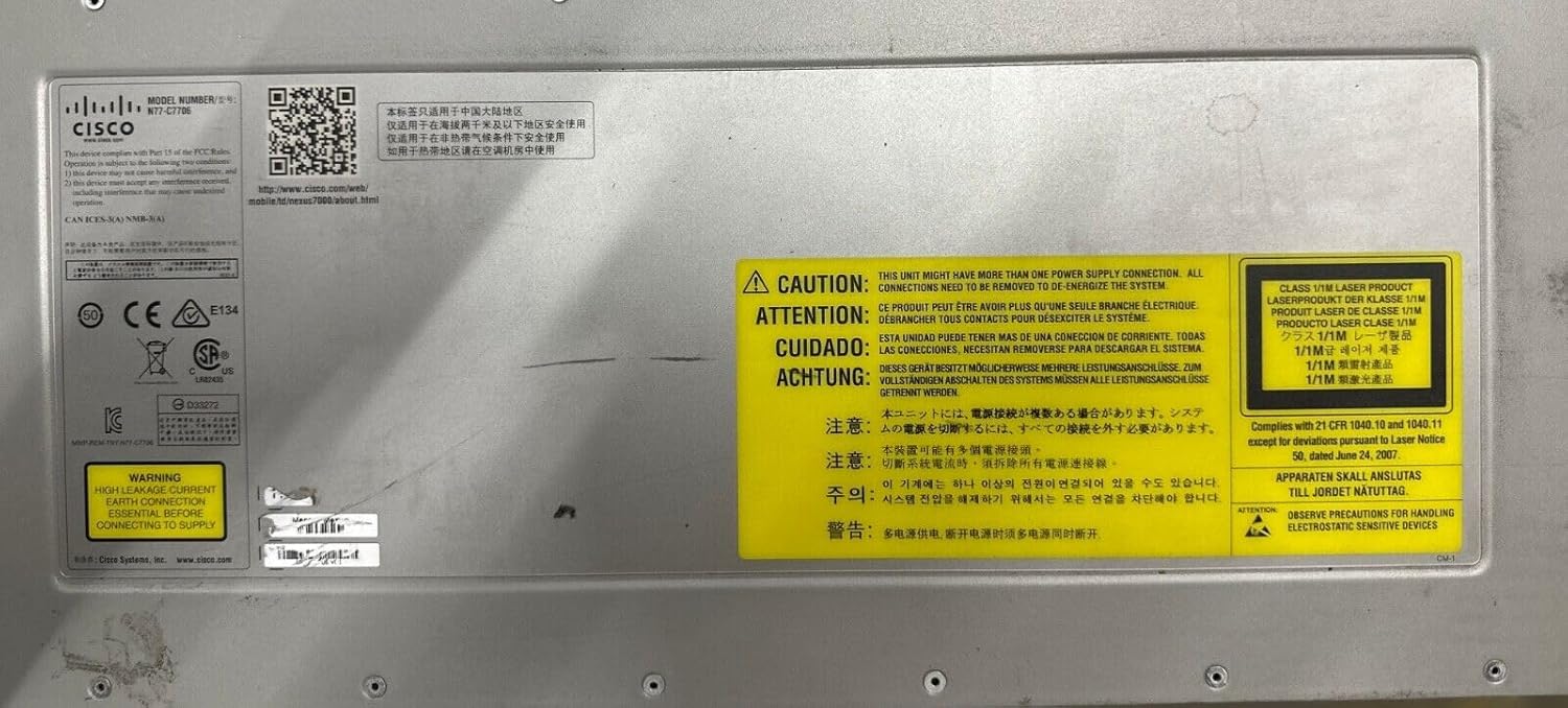 Close-up of warning labels on the Cisco Nexus 7706 chassis, indicating multiple power connections and electrostatic discharge precautions.