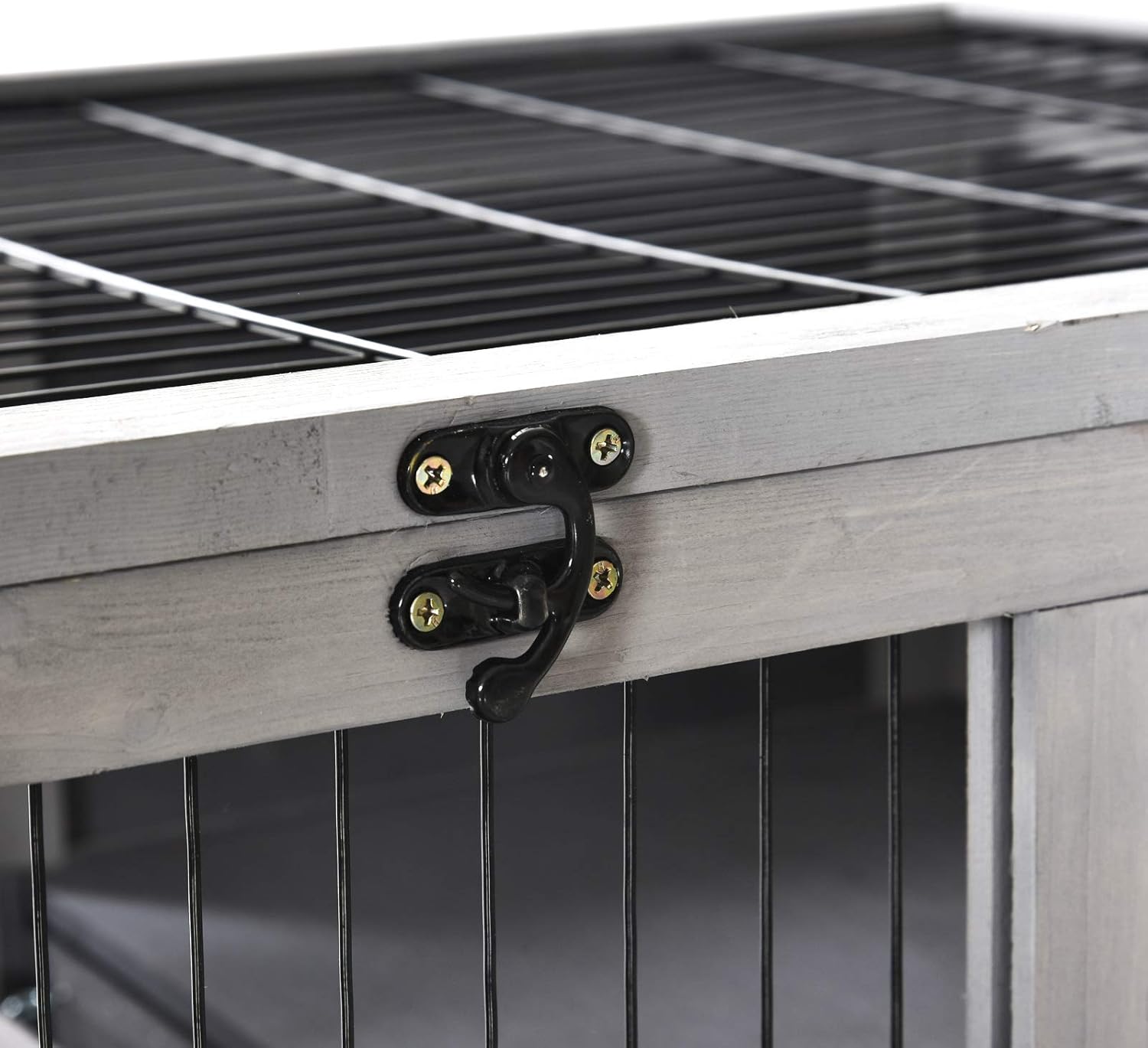 Primer pla view of a secure metal latch on the hutch door.