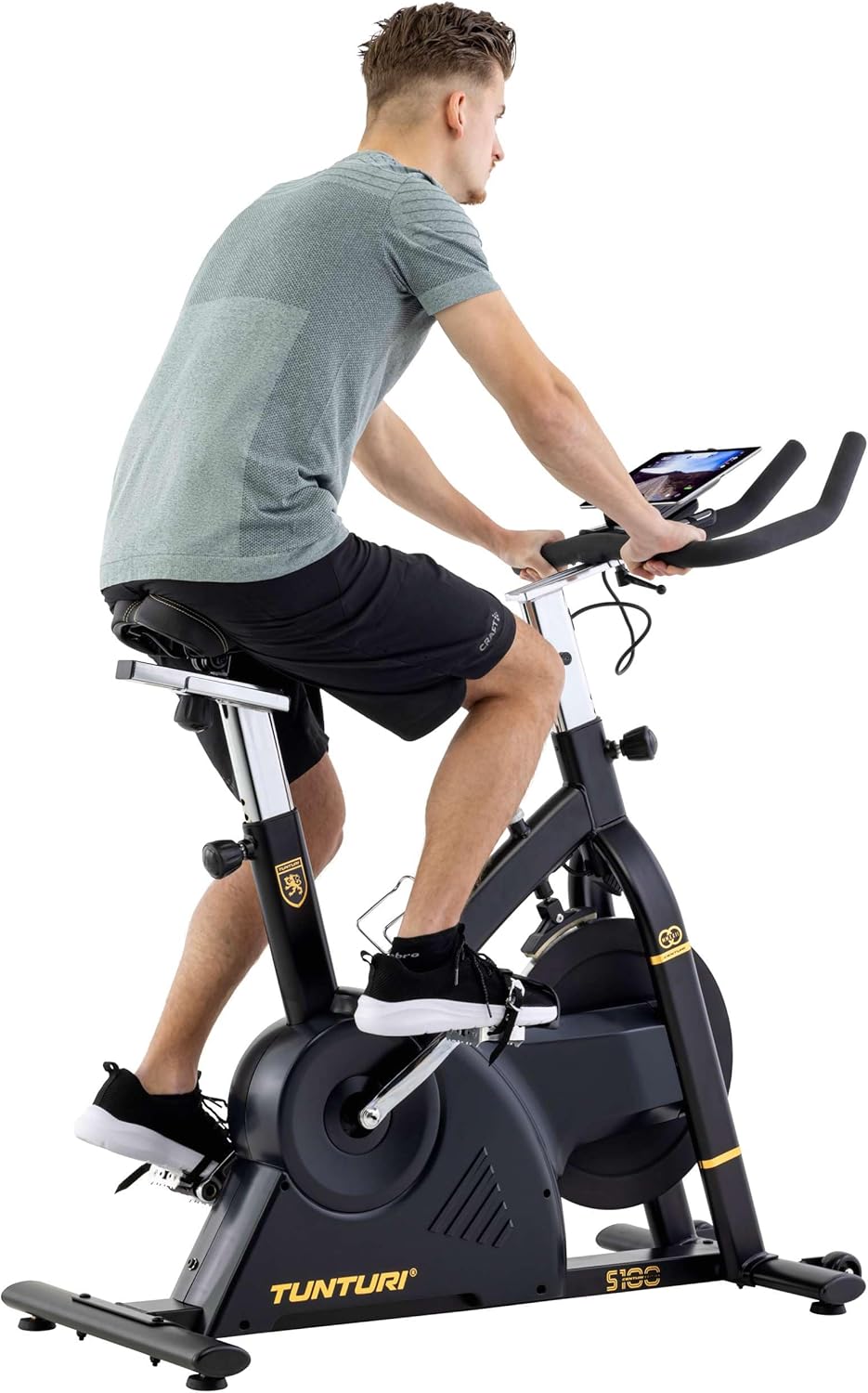 User adjusting handlebars on Tunturi S100 bike