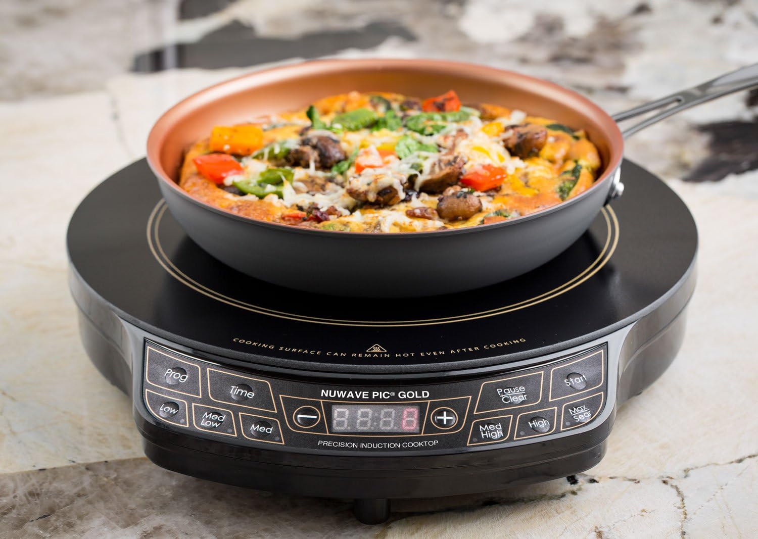 NuWave PIC GOLD Induction Cooktop with an omelet in the pan