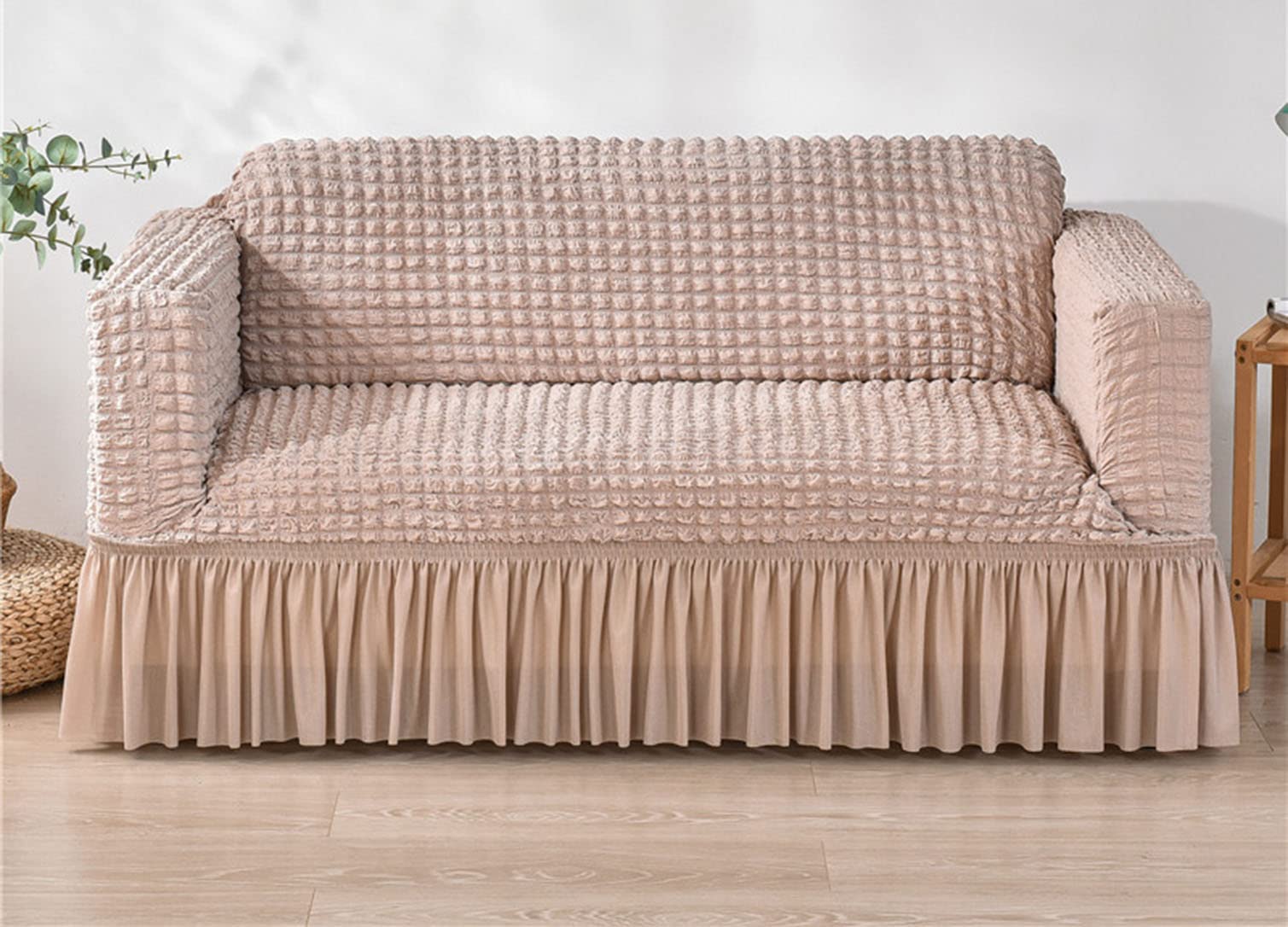 Housse de canapé extensible imperméable rose protégeant des taches