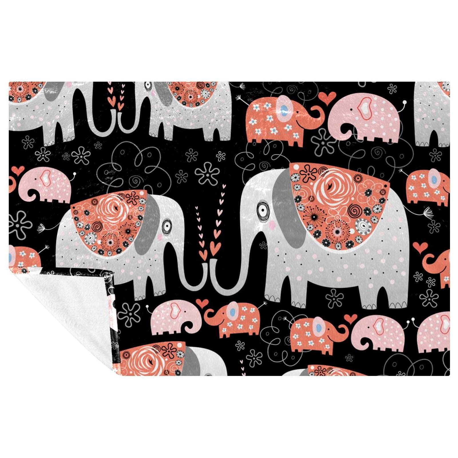 Couverture éléphant et fleurs douillette, le plaid idéal pour des instants cocooning