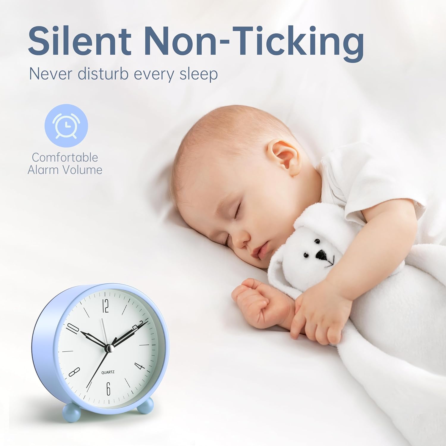 JALL Analog Alarm Clock next to a sleeping baby, illustrating silent operation