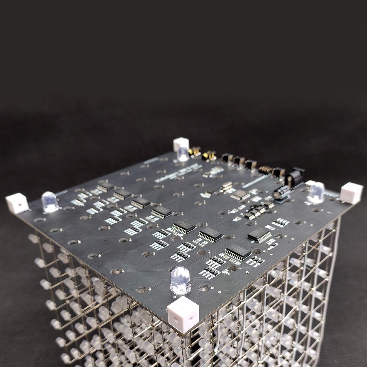 Top view of LED Cube PCB with white plastic pellets attached