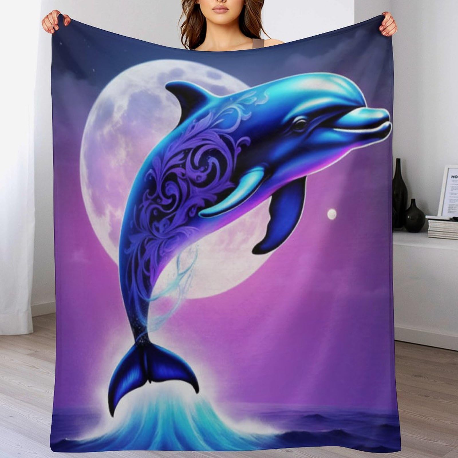 Manta de franela transpirable de delfines que evita el frio y las pelusas en tu sofa