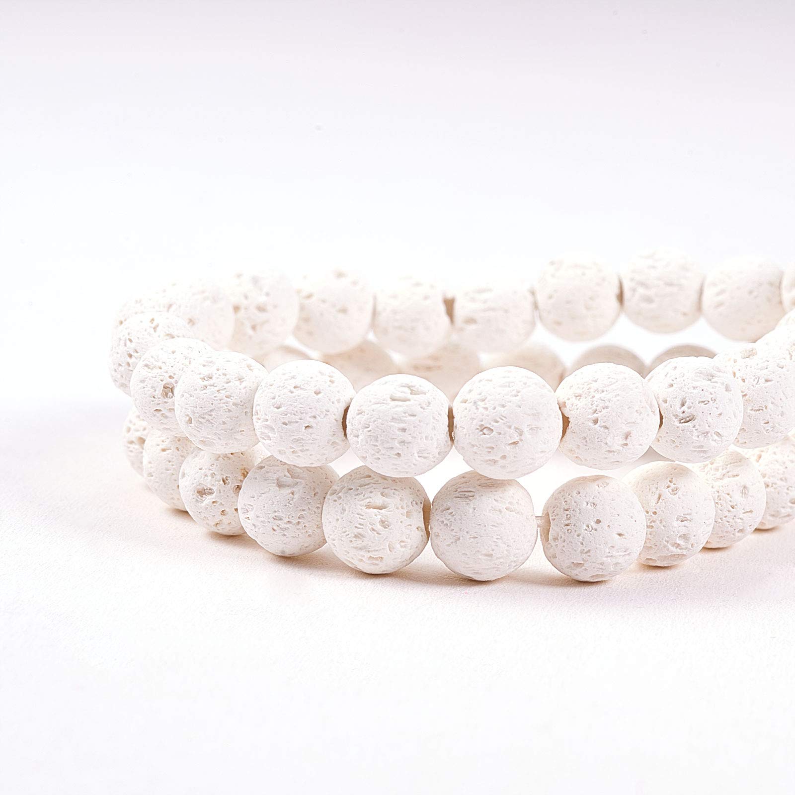 Amogeeli Fili di perle rotonde in roccia vulcanica, perline in pietra diffusore di oli essenziali, 10 mm perline di lava per braccialetti collana fabbricazione di gioielli, bianco