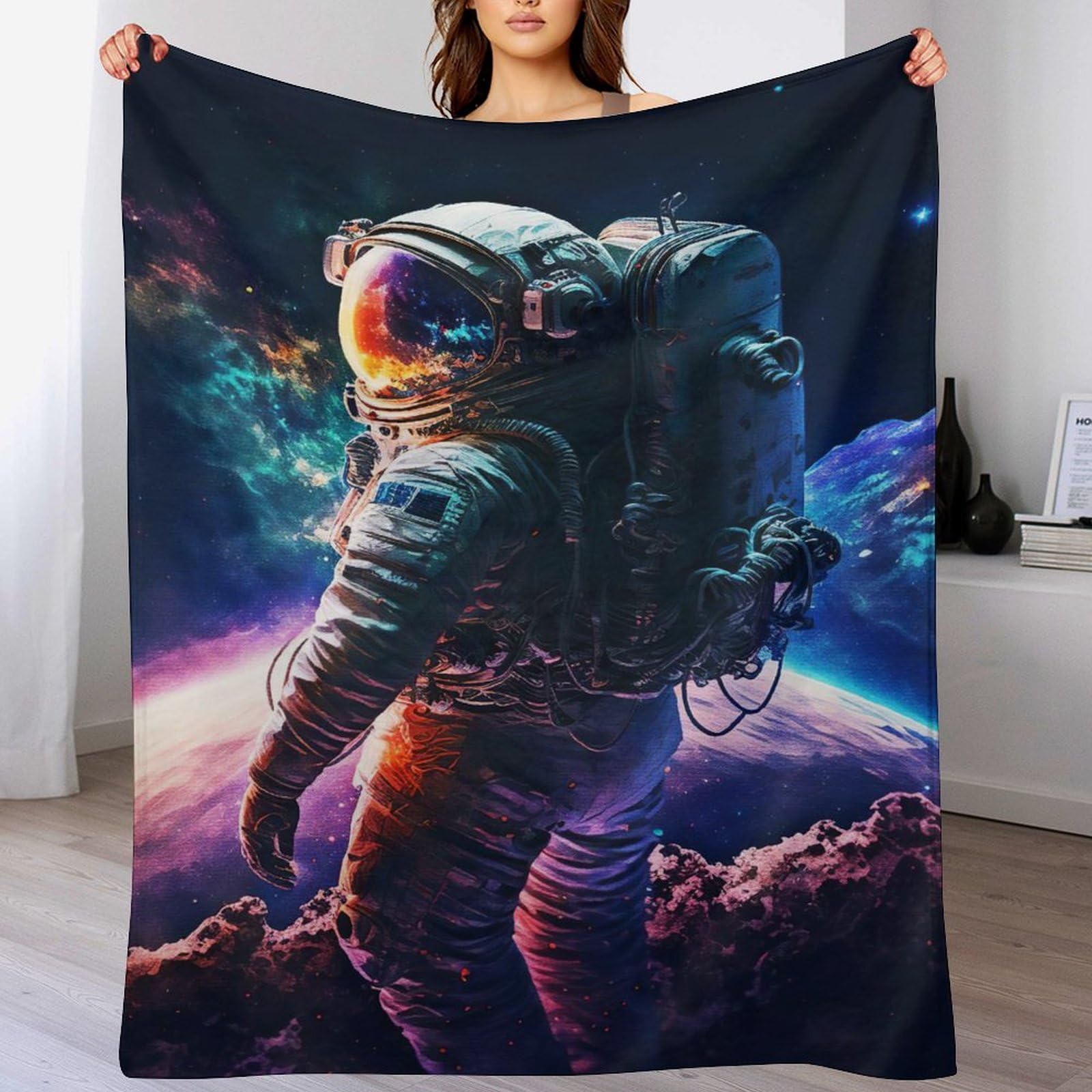 Couverture polaire astronaute idéale sur le canapé pour vos soirées cocooning