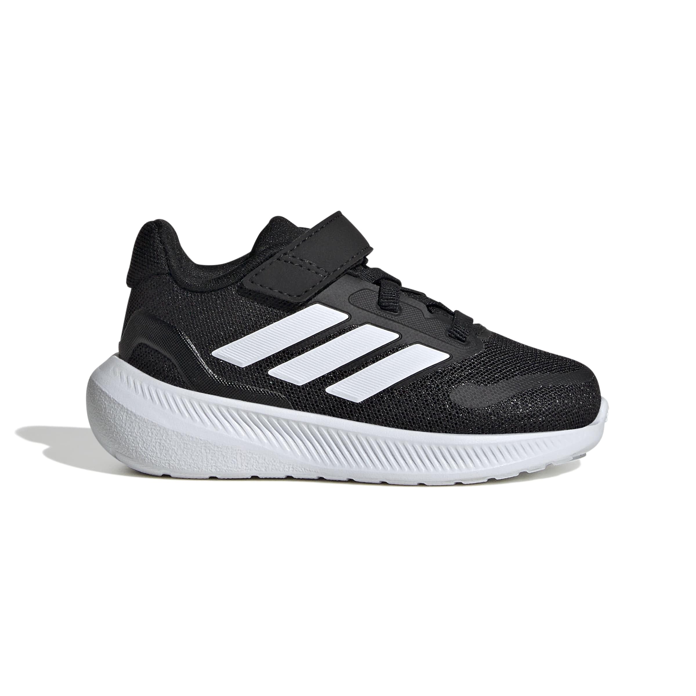 Close-up of the adidas Runfalcon 5 Kids shoes, highlighting the hook-and-loop fastening system.