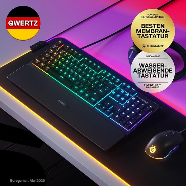Nahaufnahme der SteelSeries Apex 3 Gaming-Tastatur mit hervorgehobener RGB-Beleuchtung und magnetischer Handballenauflage.