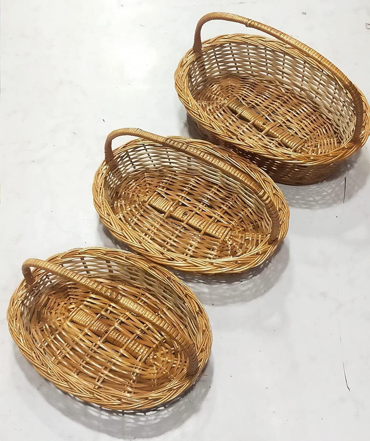 Avika Oval Handle Cane Bamboo Basket for Multipurpose uses for Hamper Chocolate Flower Pooja Cane Basket,Festival Gifts Packing with Handle Set of 3 Baskets. Size 14 inch, 13 inch,12 inch