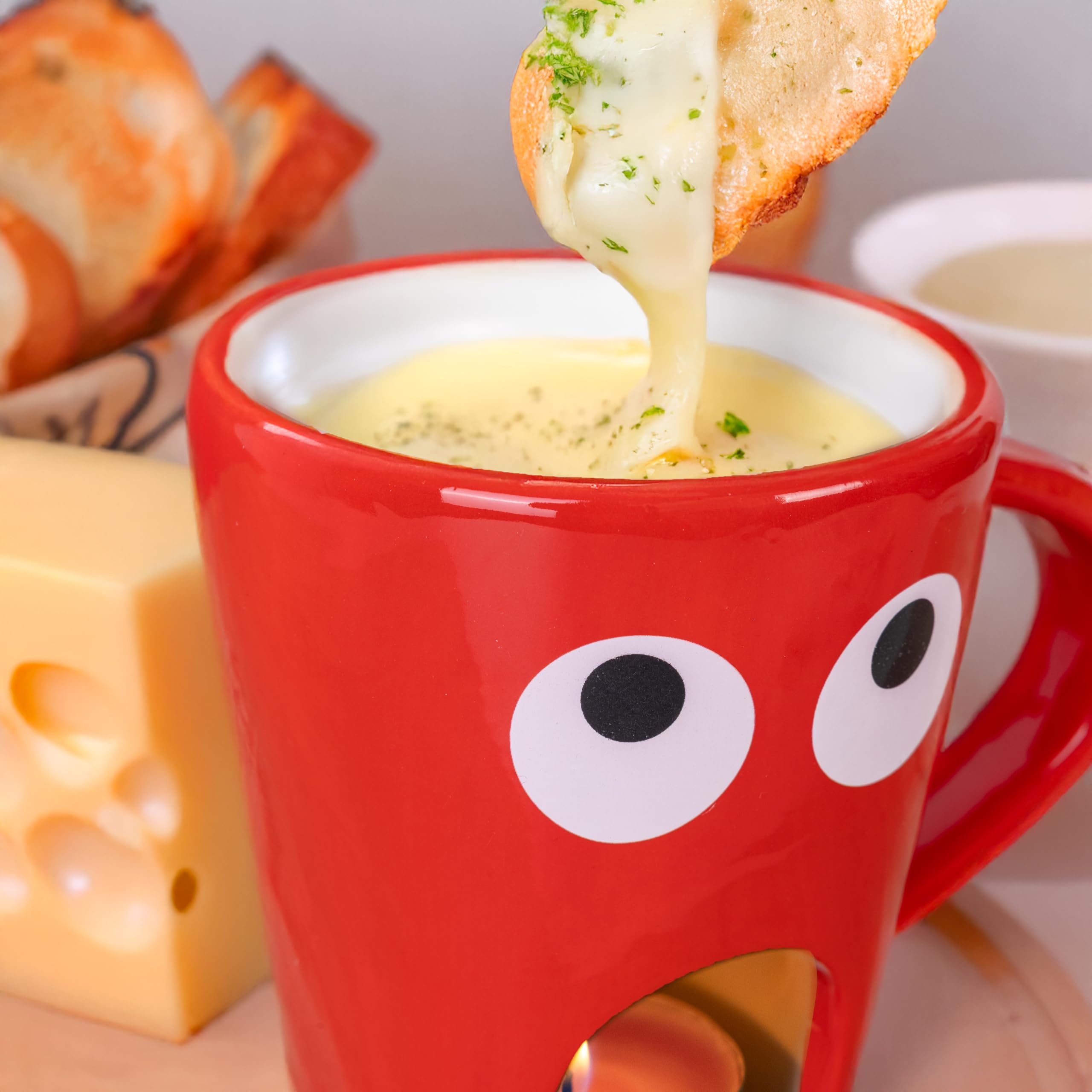 Fisura – Taza fondue chocolate original. Fondue de queso con taza y tenedor. Taza roja con estampado de ojos para fondue. Taza original para regalo. 140 mililitros
