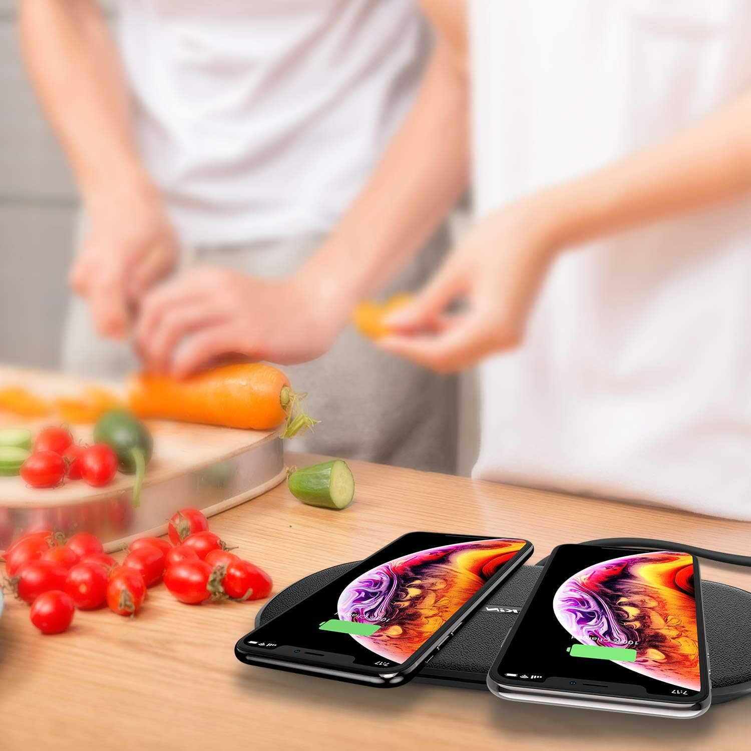 Nillkin Dual Wireless Charging Pad in use, charging two smartphones.