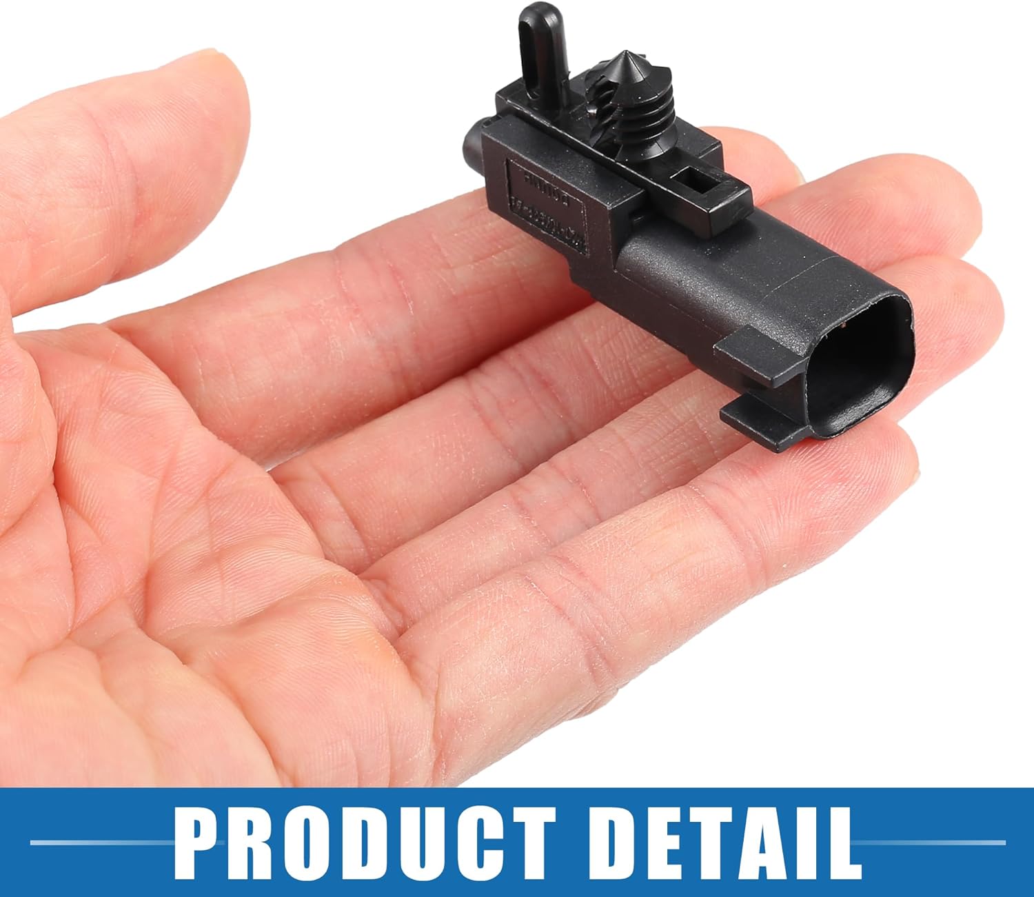 The sensor held in a hand, providing a sense of its small scale.