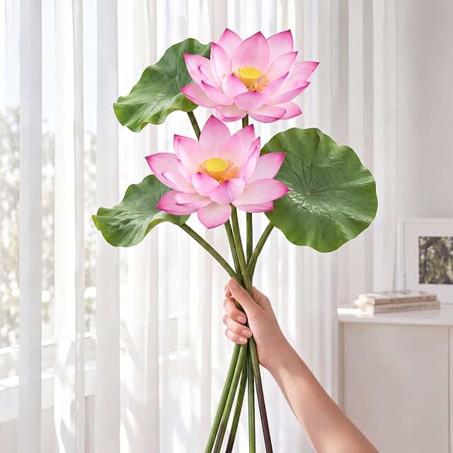 Artificial pink lotus flowers and leaves on flexible stems
