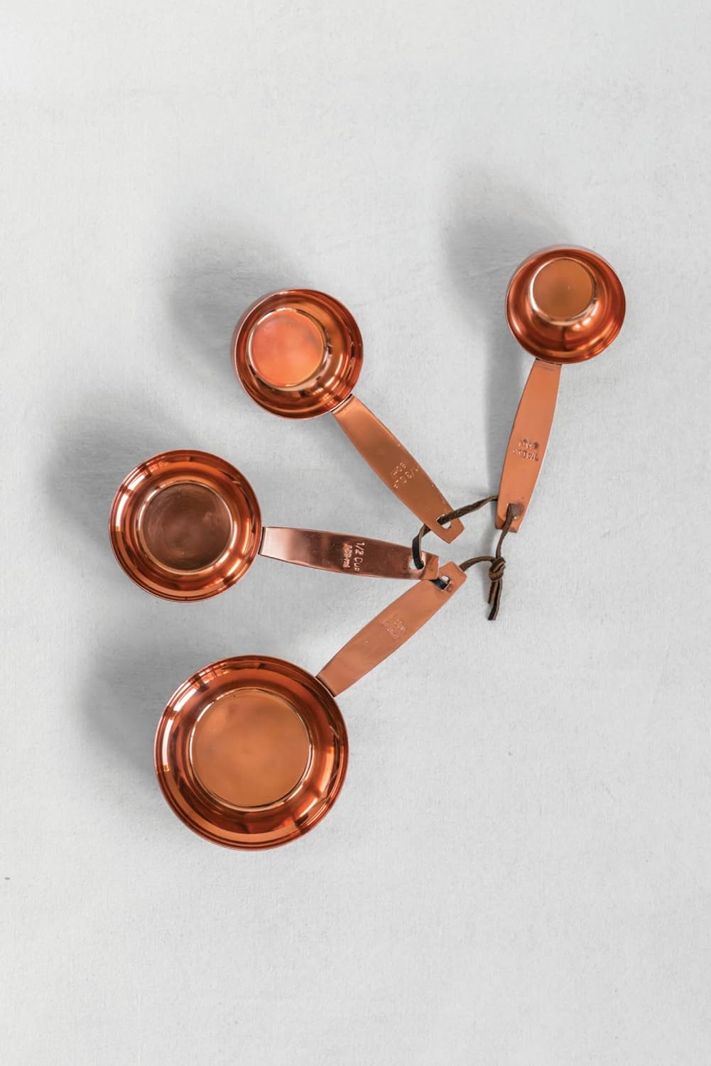 Creative Co-Op Set of 4 Metal Measuring Cups with Leather with Copper Finish