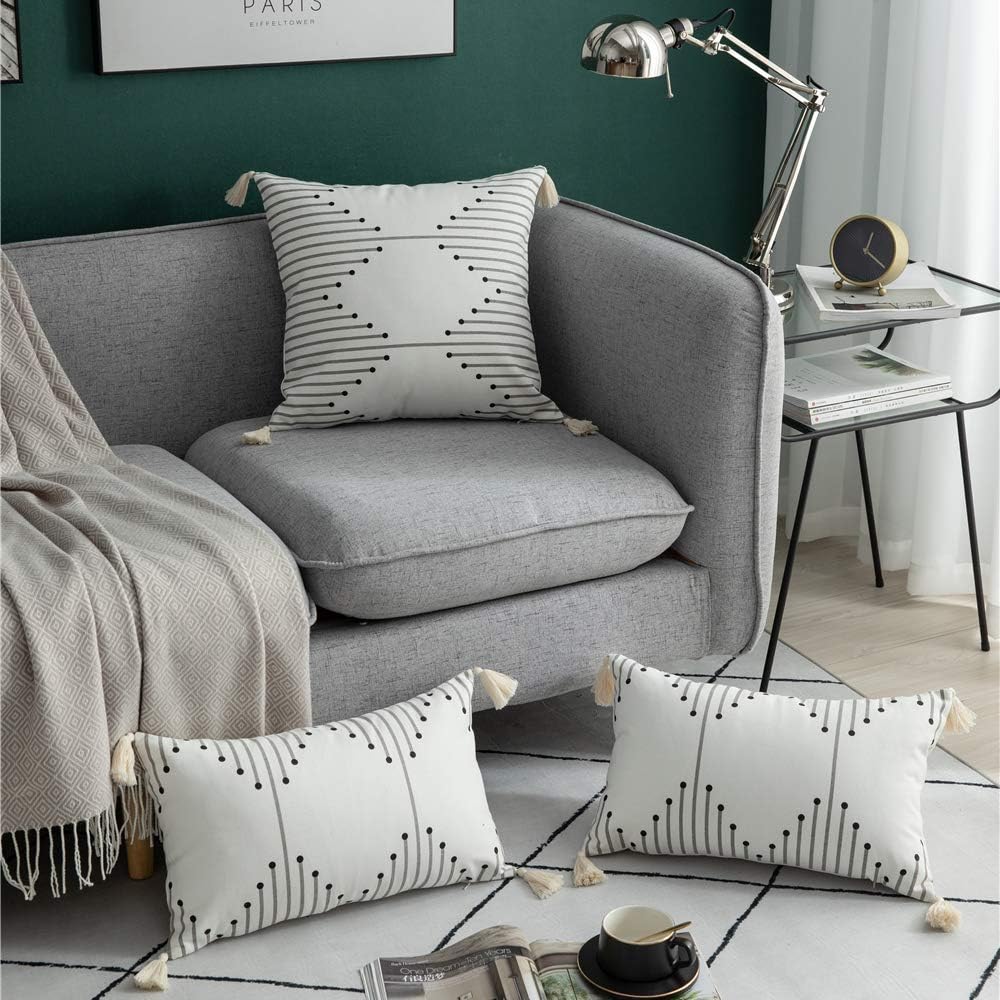 DEZENE Decorative Throw Pillow Covers for Couch Sofa Bed, 2 Pack 100% Cotton Rectangle Lumbar Pillow-Cases with Tassels, Boho Euro Cushion Covers for Farmhouse, Kids, 12 x 20 Inch Black and White