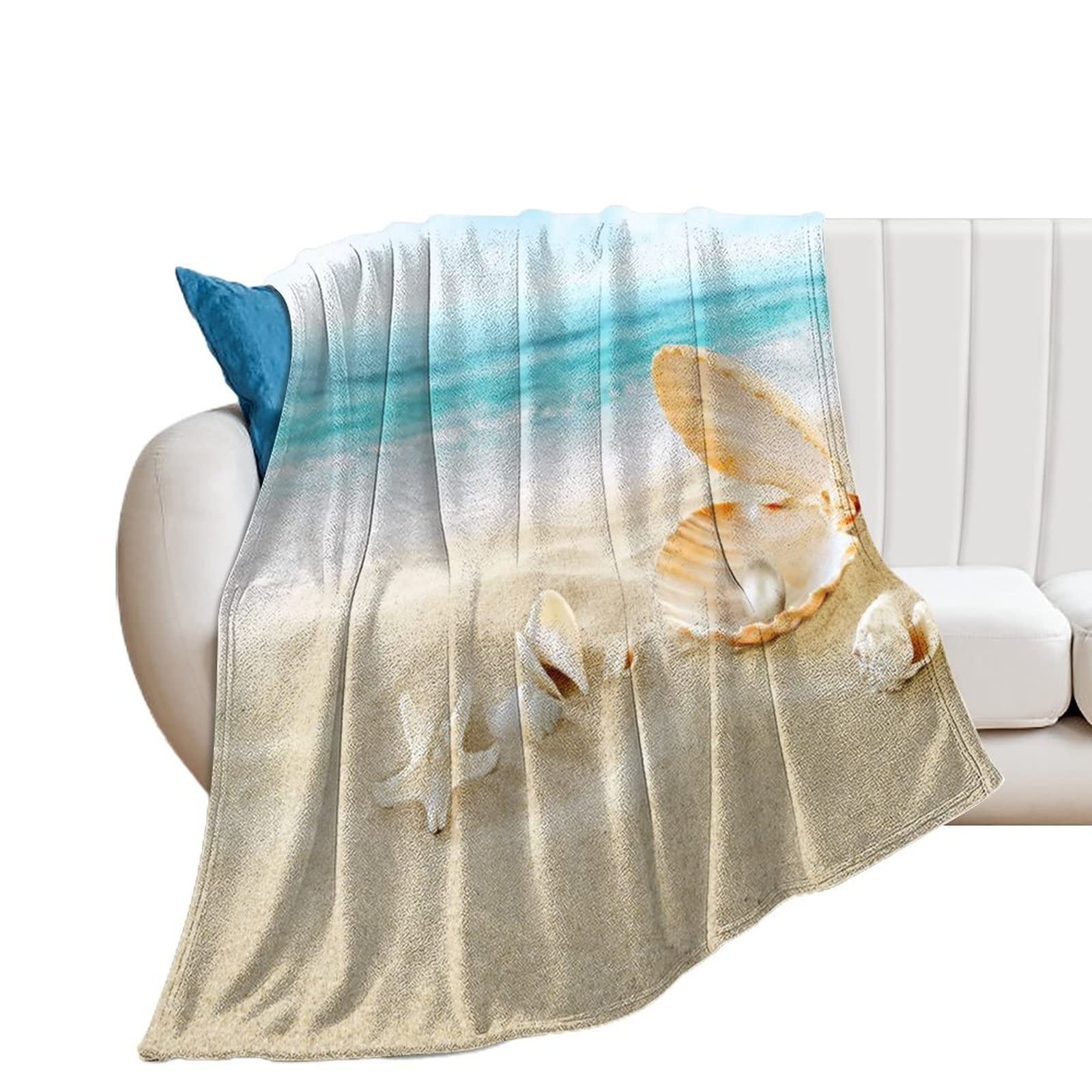 Jeté de lit coquillage pour des soirées cocooning sur le canapé