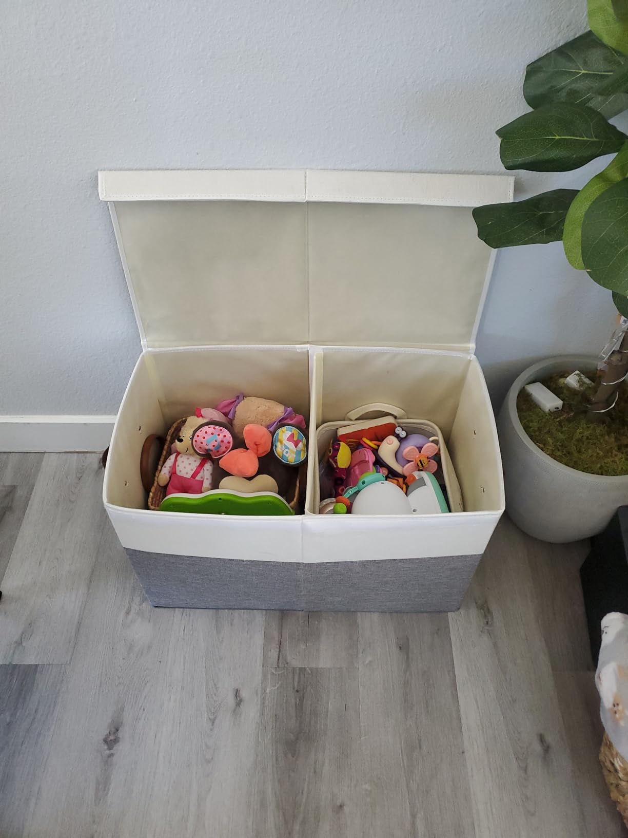 Toys stored neatly in fabric storage bins