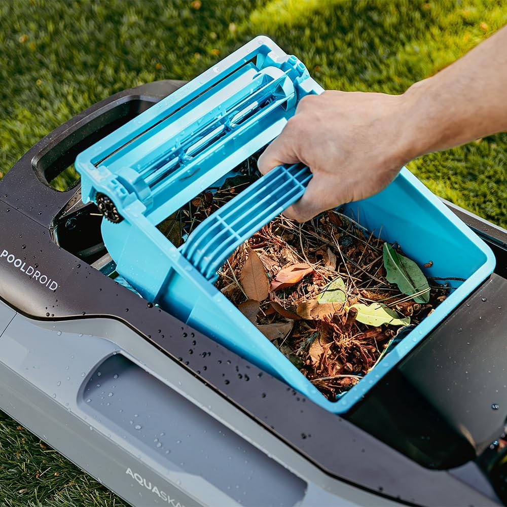 Hand removing the filter basket from Cecotec Conga Pooldroid AquaSkater