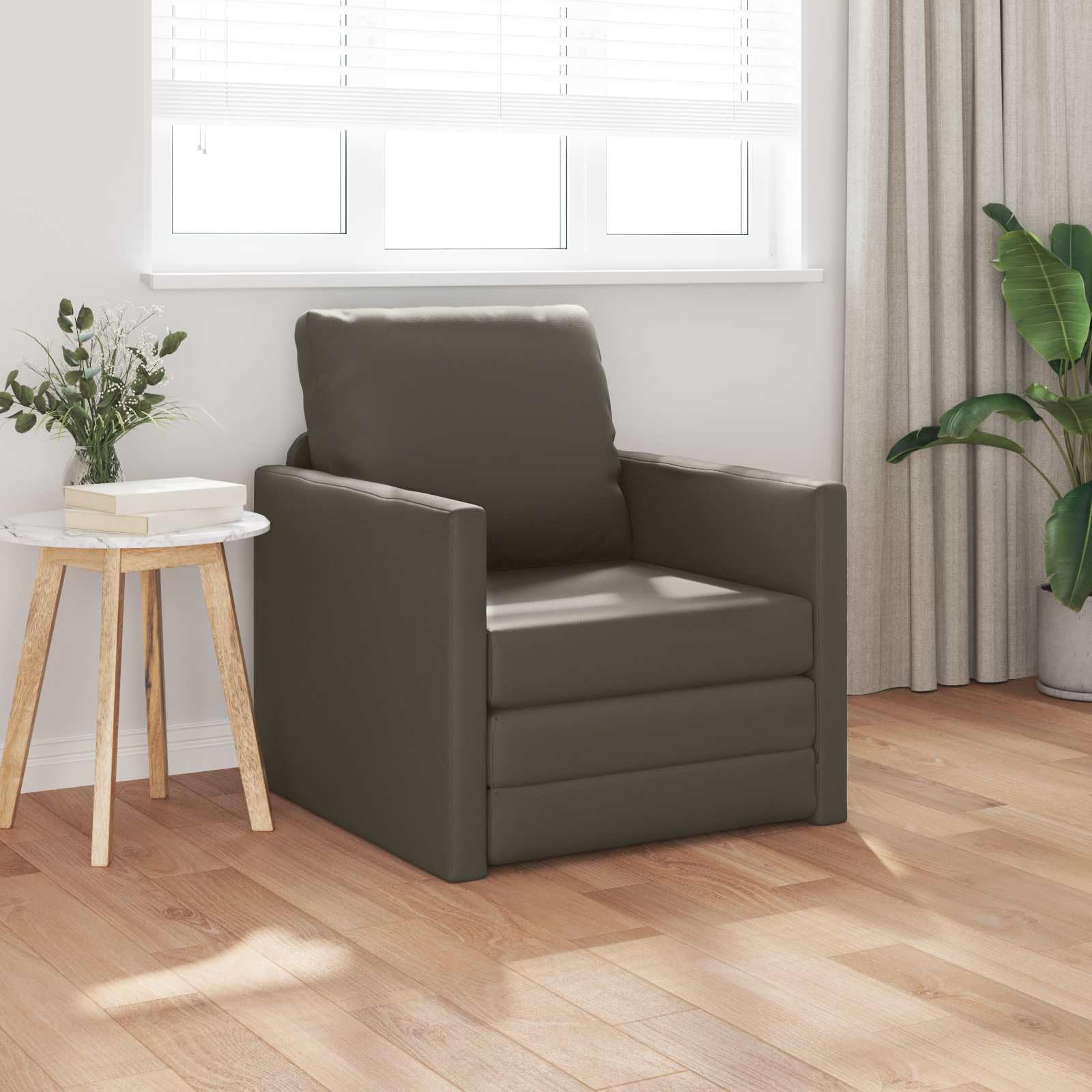 Sofá cama gris de cuero artificial para optimizar habitaciones de invitados y despachos
