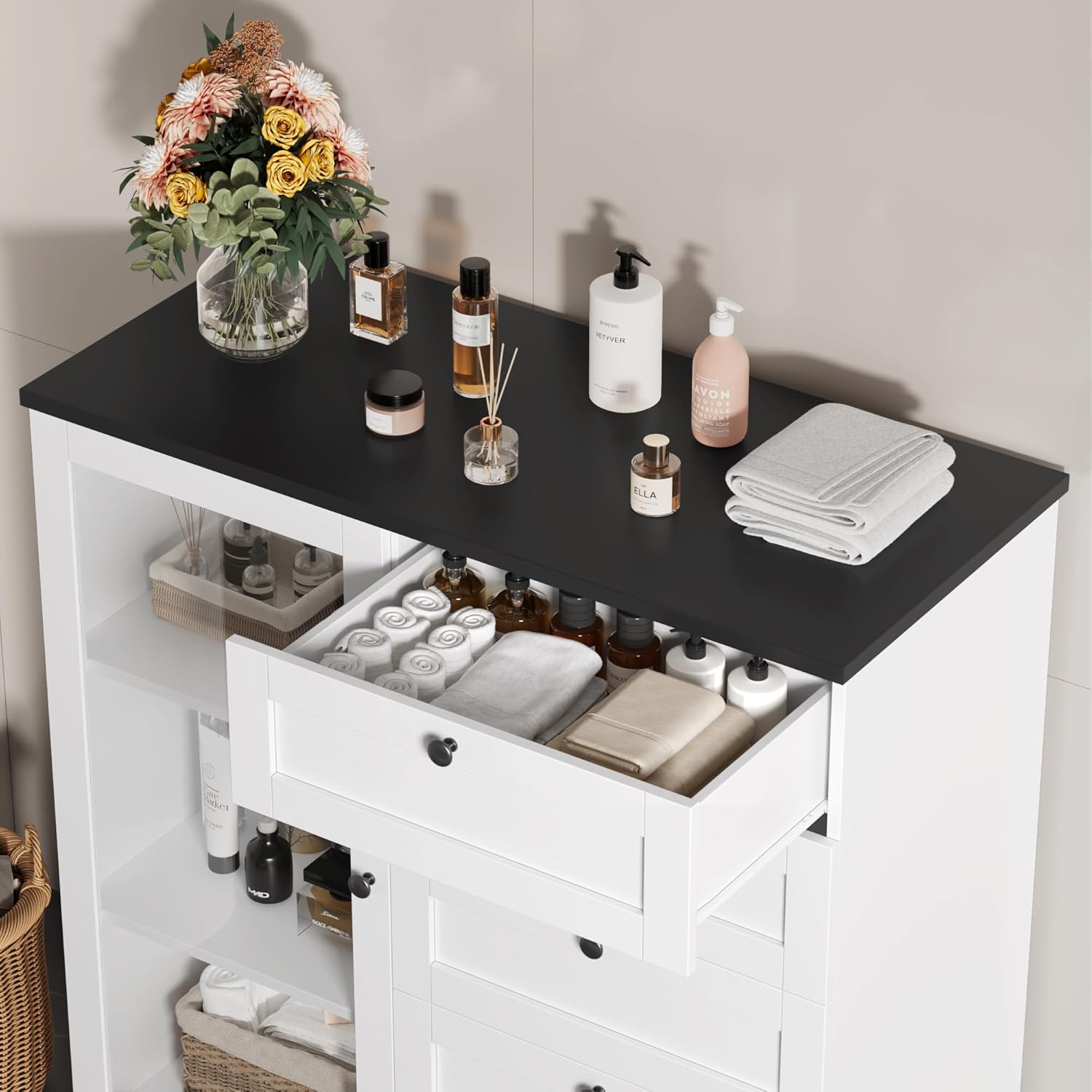 Close-up of the dresser showing an open drawer with items and the top surface with decorative items