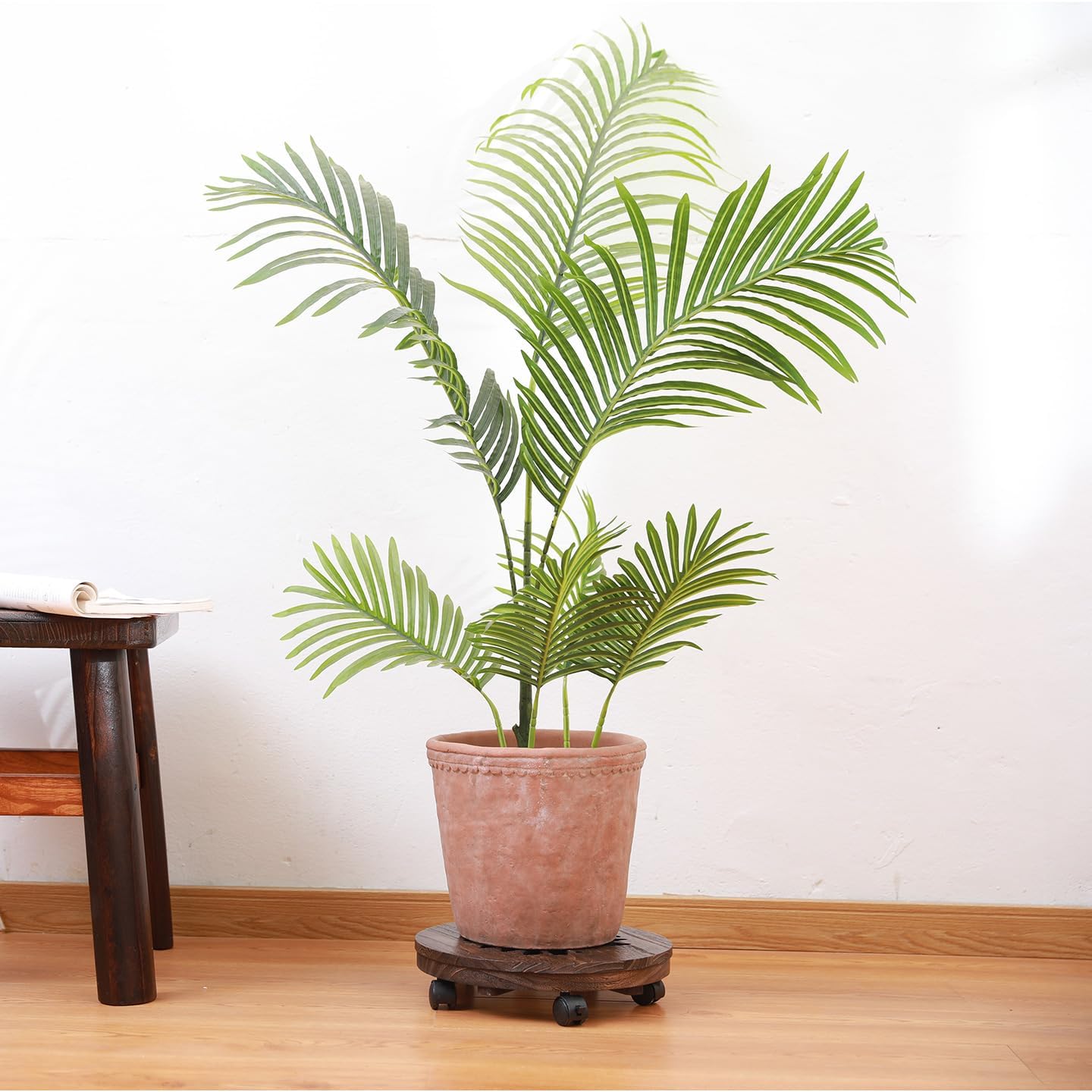 Addy Plant Stand with Wheels: A heavy-duty wooden caddy for indoor and outdoor use. It features lockable wheels and is suitable for patios and flower pots. Ideal for moving potted plants. (13“)