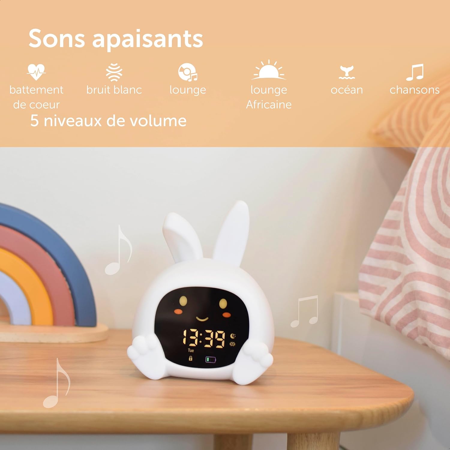 ZAZU Sarah alarm clock on a bedside table, illustrating its soothing sound machine function with musical notes.