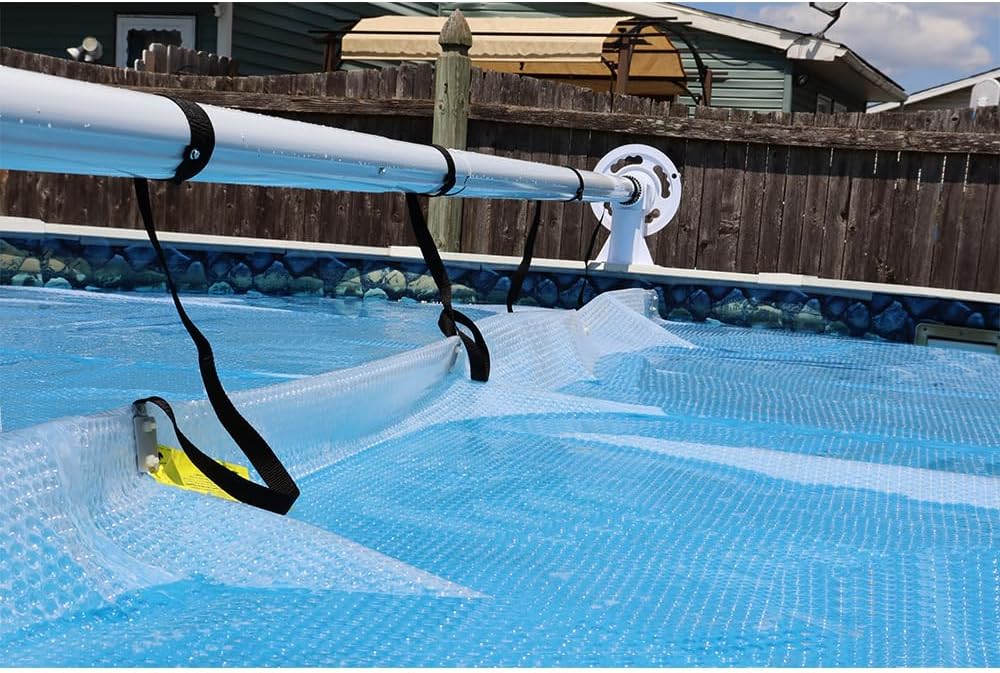 Z bliska view of the Sun2Solar Solar Cover Reel System with the solar cover being reeled in, showing the straps connecting the cover to the reel.