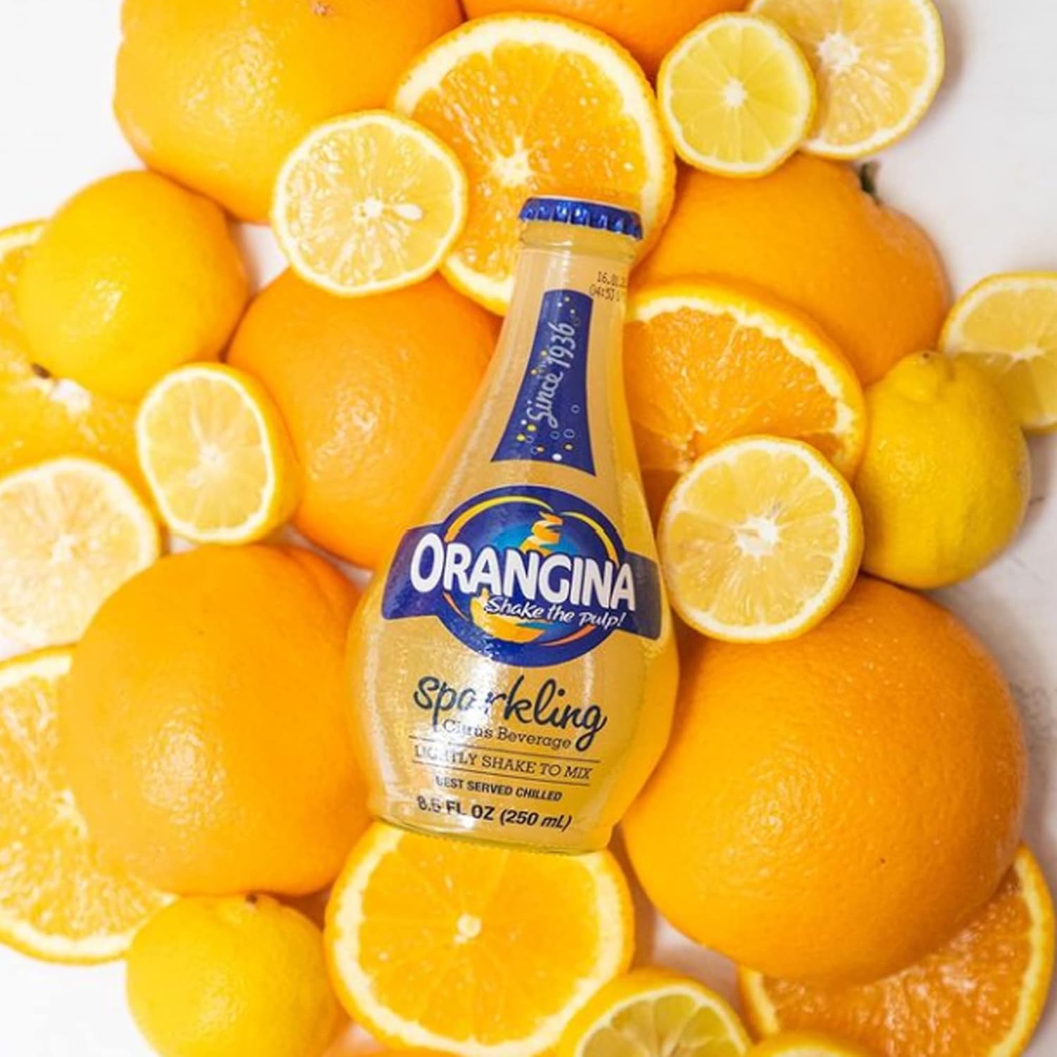 Orangina - Citrus Sparkling Juice Beverage (18 Bottles Total) - Light Pulp - Original Imported European French Recipe - No Artificial Ingredients - (3 Packs of 6 Bottles) (18 x 8.5 oz Bottle)