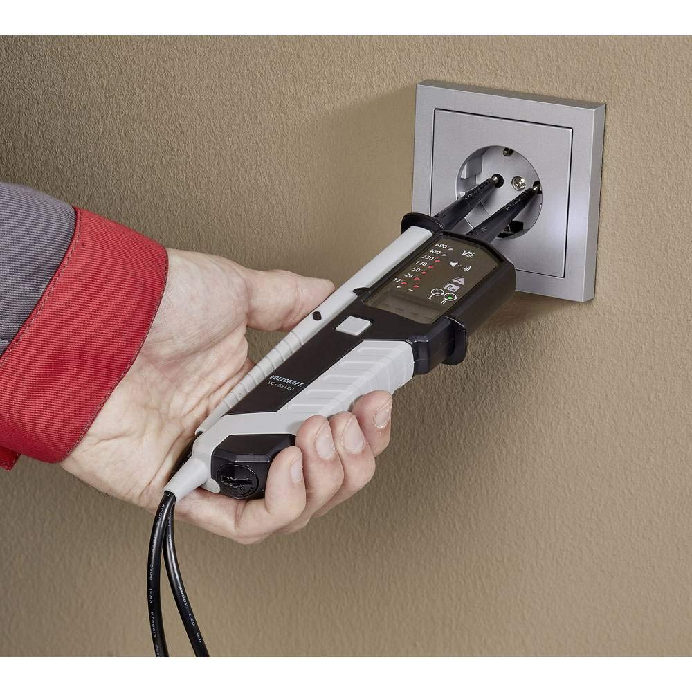 VOLTCRAFT VC-55 LCD in use testing a wall socket