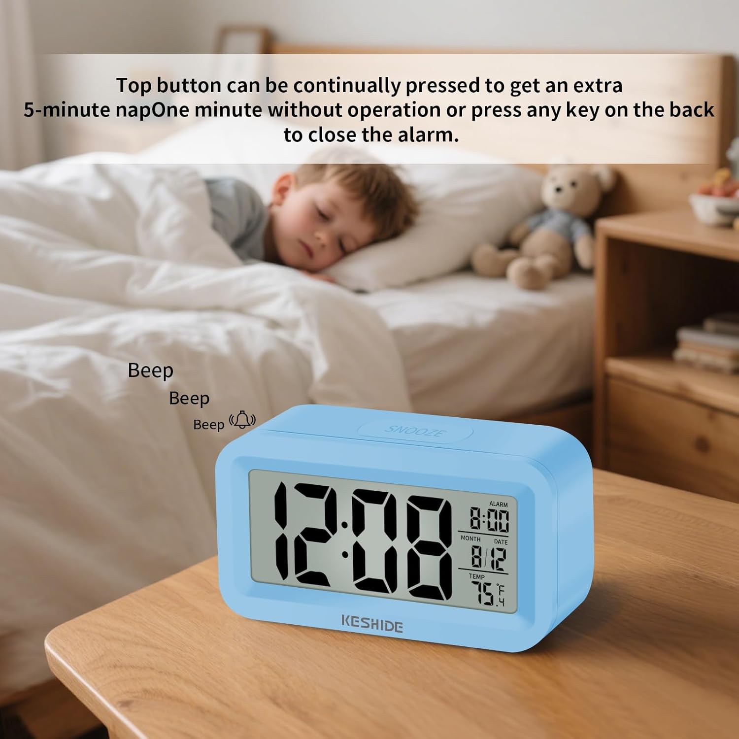 KESHIDE Digital Alarm Clock on a bedside table, showing the snooze function. The display shows 12:08, with an alarm set for 8:00, and temperature 75.4F. Text indicates 'Top button can be continually pressed to get an extra 5-minute nap. One minute without operation or press any key on the back to close the alarm.'