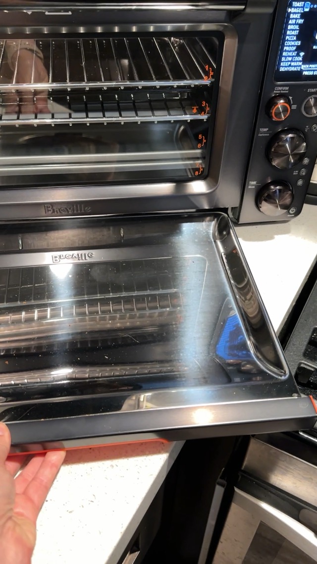 Breville the Joule Oven Air Fryer Pro with crumb tray pulled out