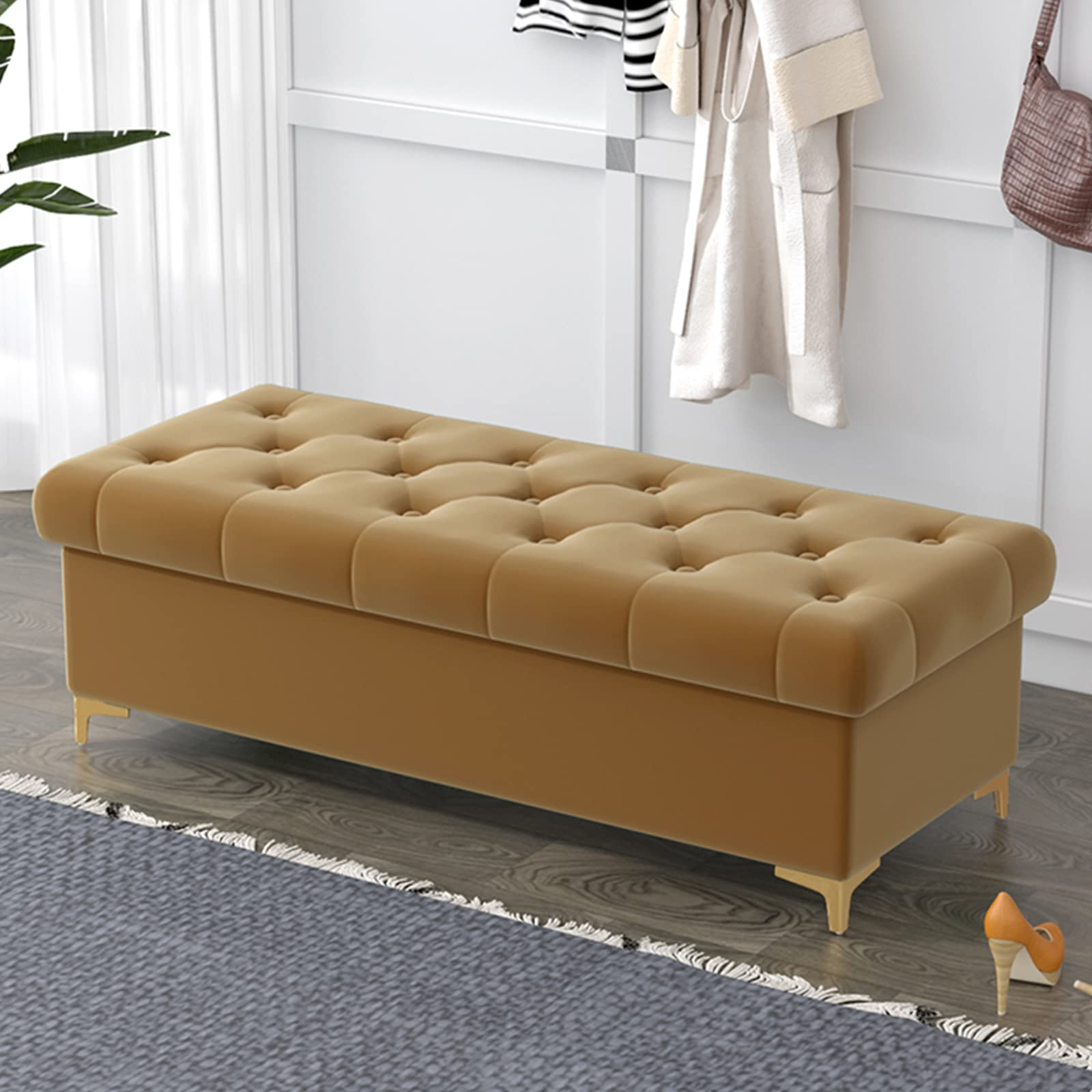 Banc de rangement en velours chic capitonné et pieds dorés