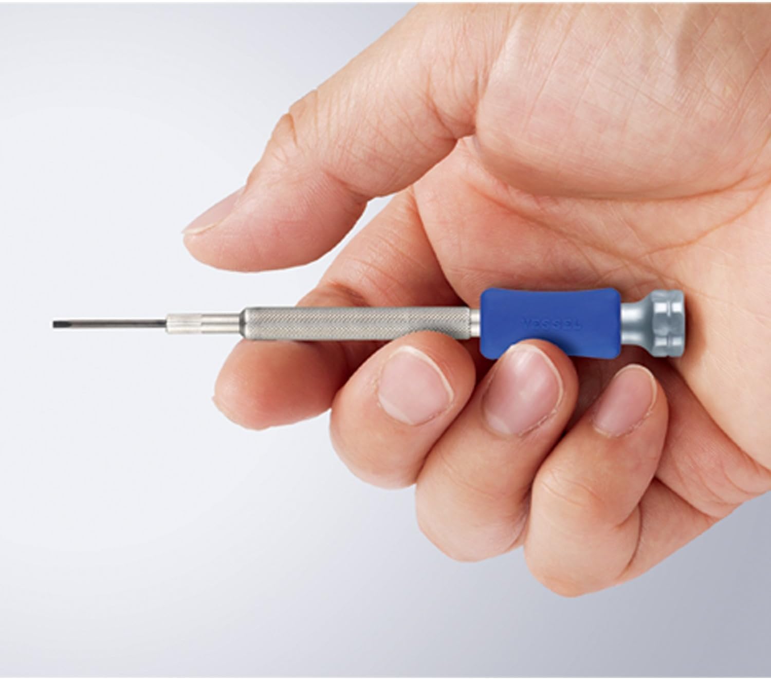 VESSEL precision screwdriver in use on a small electronic component