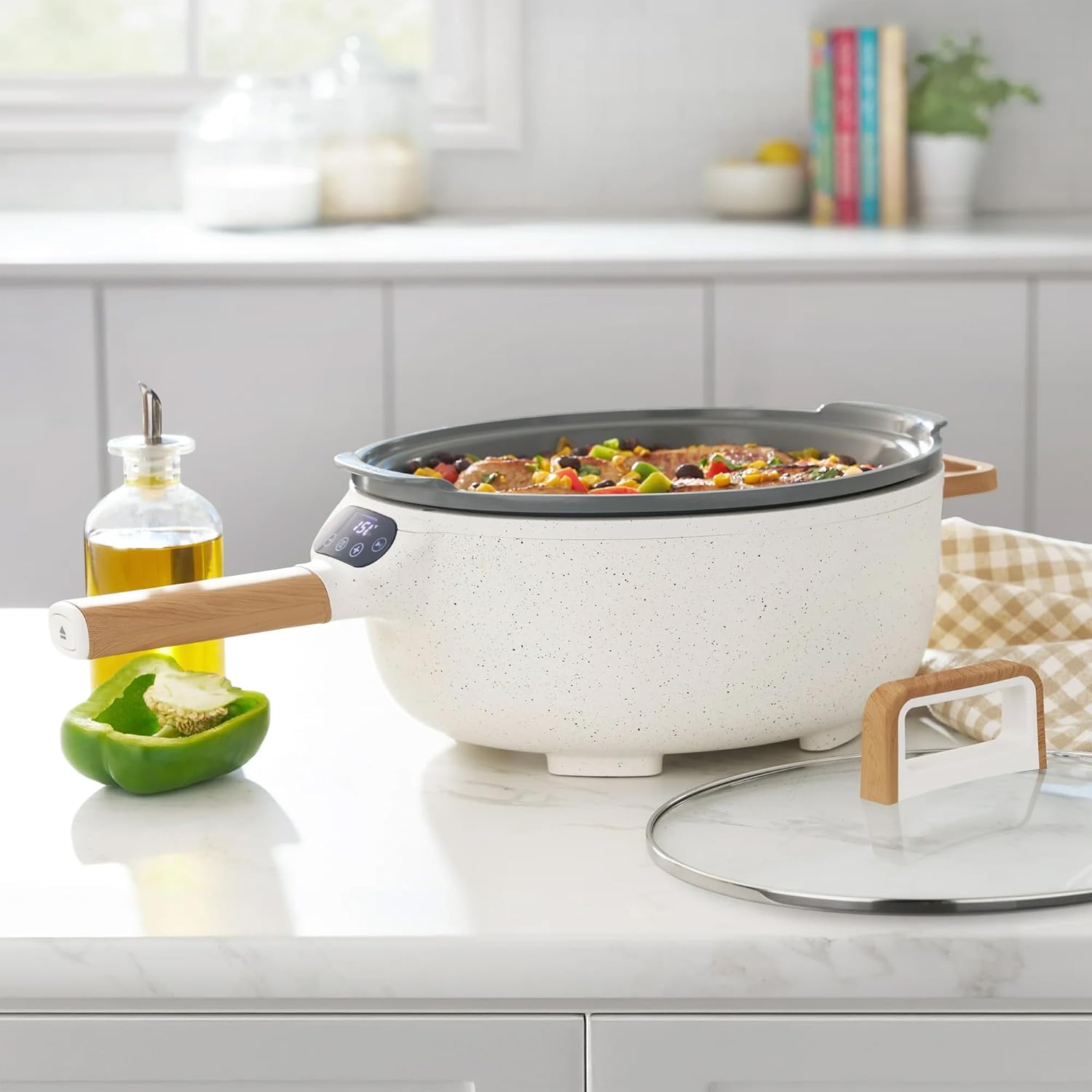 Electric Skillet in a kitchen setting with food