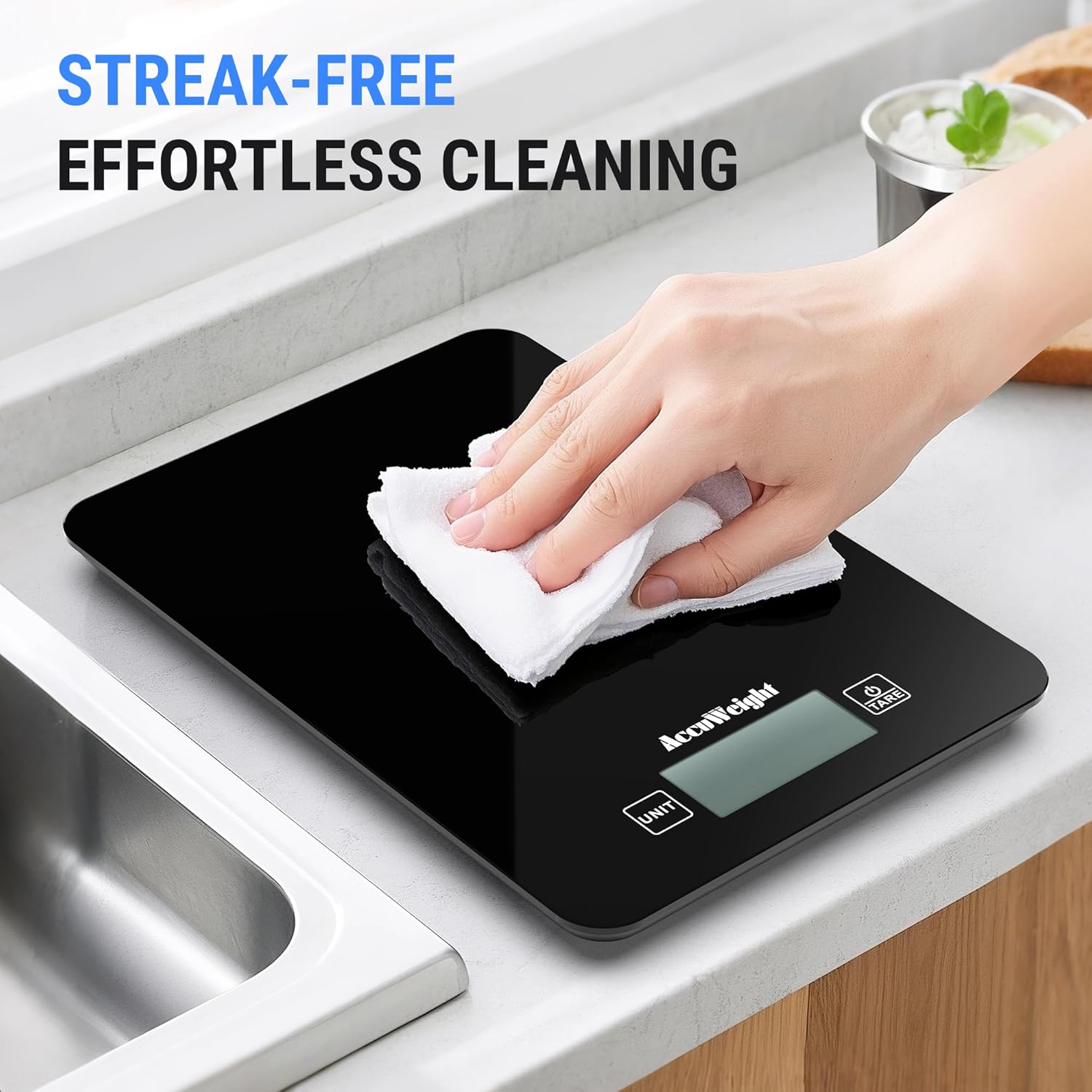 A hand wiping the surface of the ACCUWEIGHT CK780 scale, illustrating its streak-free and effortless cleaning process.