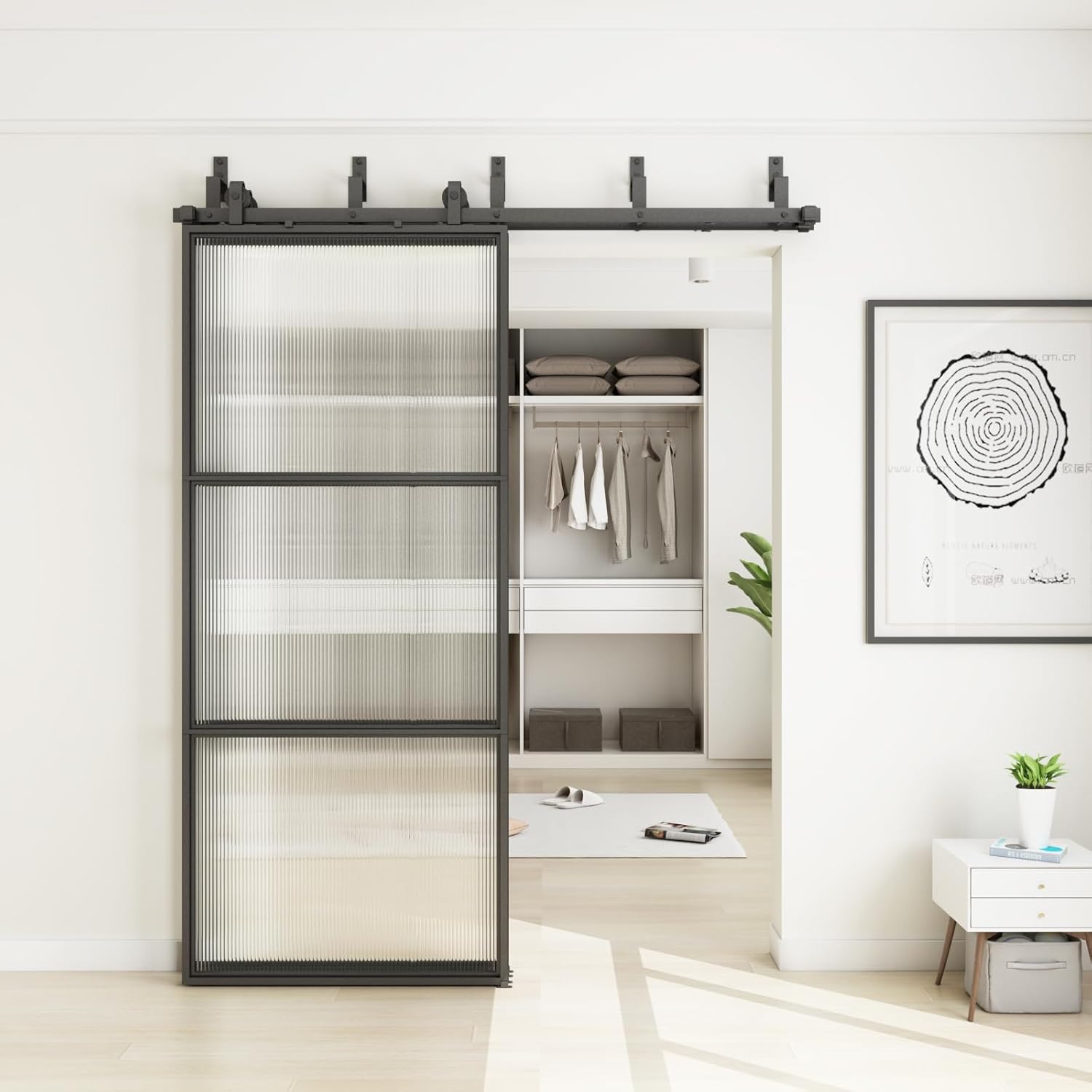 JUBEST Bypass Glass Barn Door partially open, revealing a closet interior.