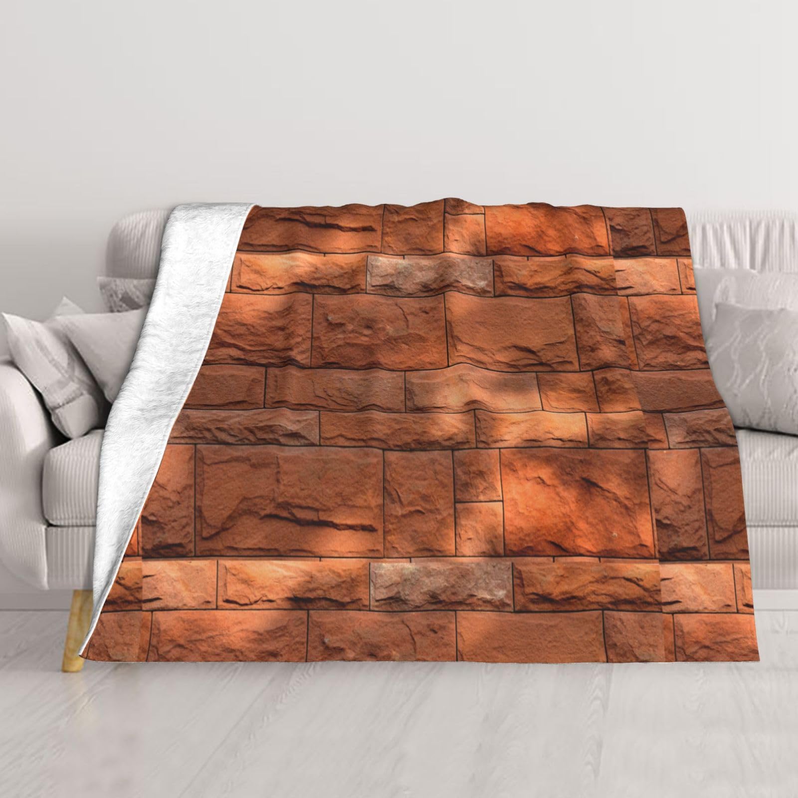Couverture lit effet brique chaude pour vos soirées cocooning sur le canapé