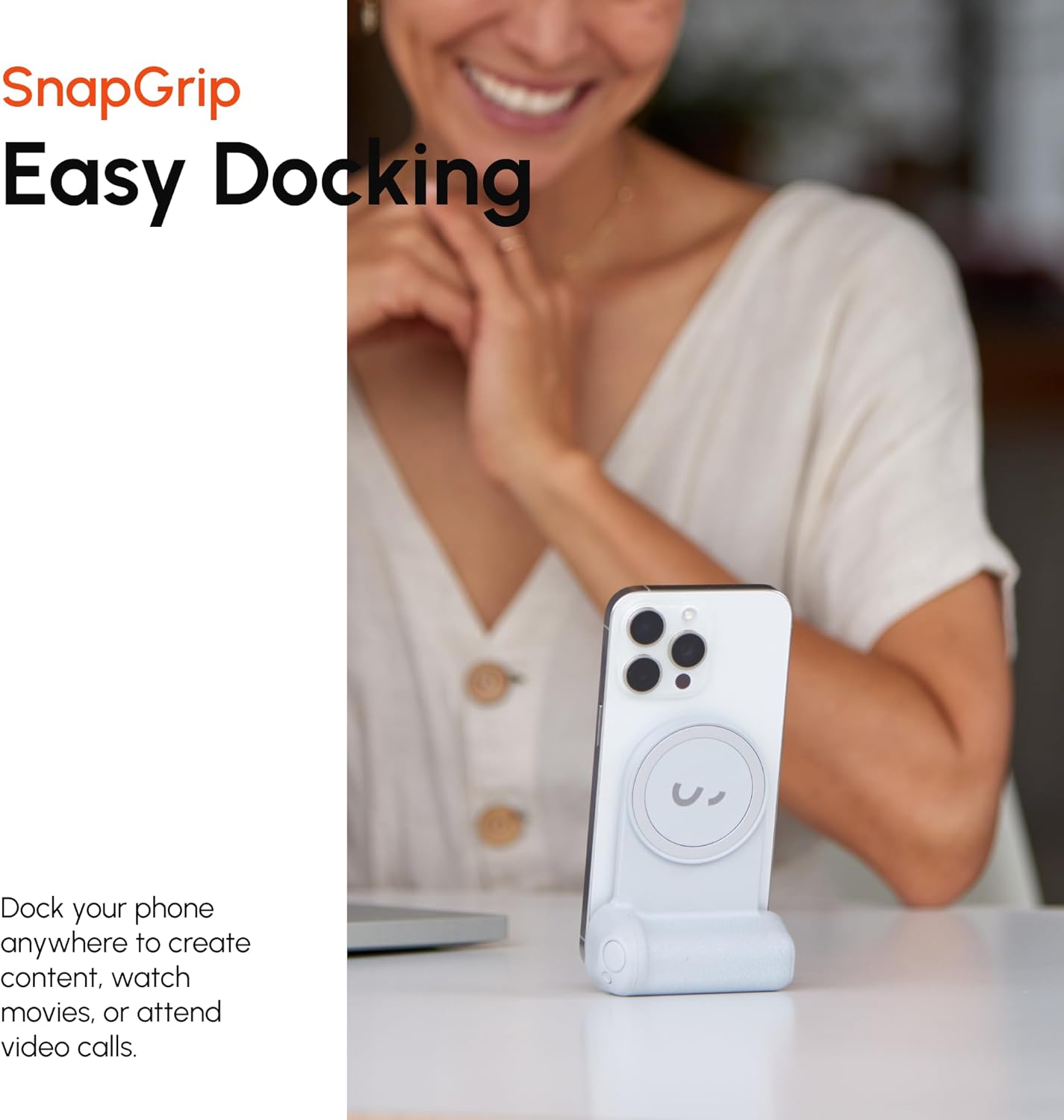 A smartphone docked vertically on the SnapGrip Pro, resting on a table, demonstrating its use as a hands-free stand.