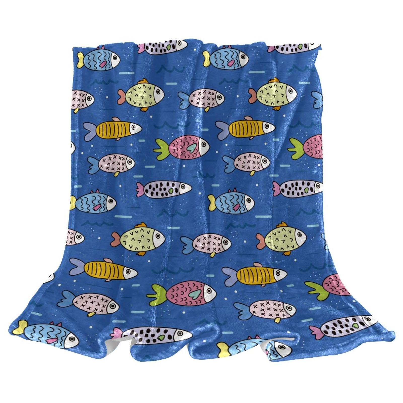 Couverture polaire poisson pour stopper le froid sur votre canapé avec ce plaid chaud