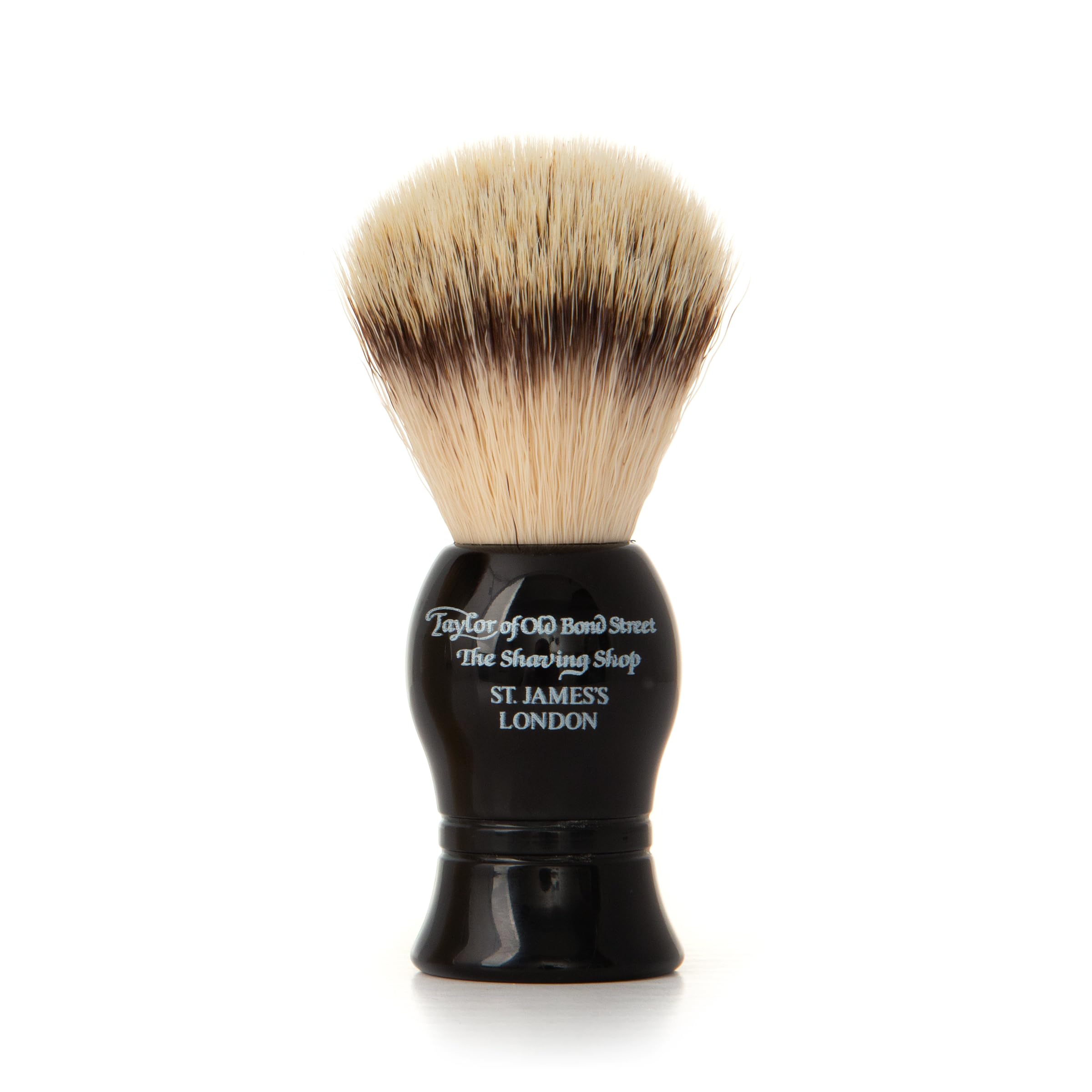 Taylor of Old Bond Street Blaireau de rasage en fibres synthétiques végétaliennes. Ce blaireau de rasage d'entrée de gamme dispose d'un manche en résine noire. Fabriqué en Grande-Bretagne.